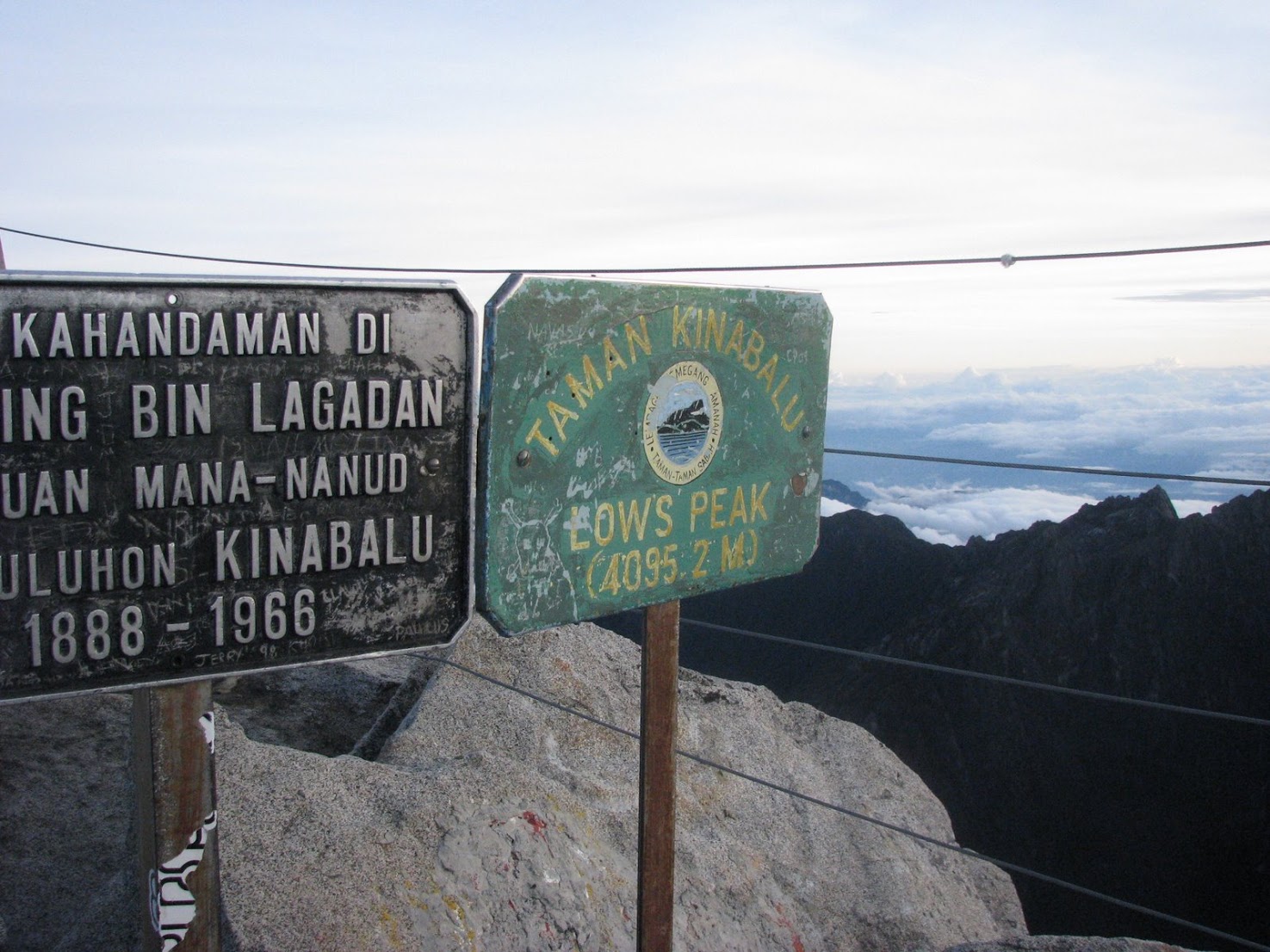 Weathered signs on the rocky summit of Mount Kinabalu